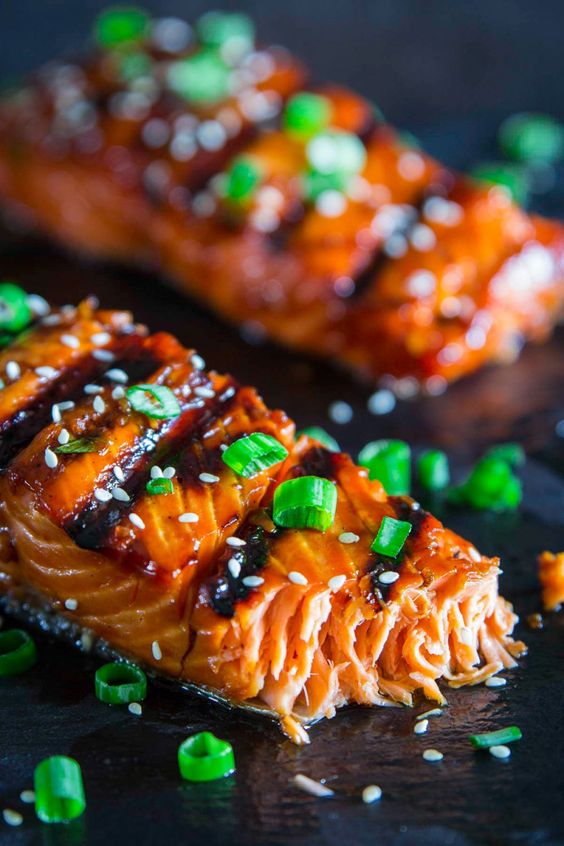 Delicious grilled salmon  garnished with green onions.